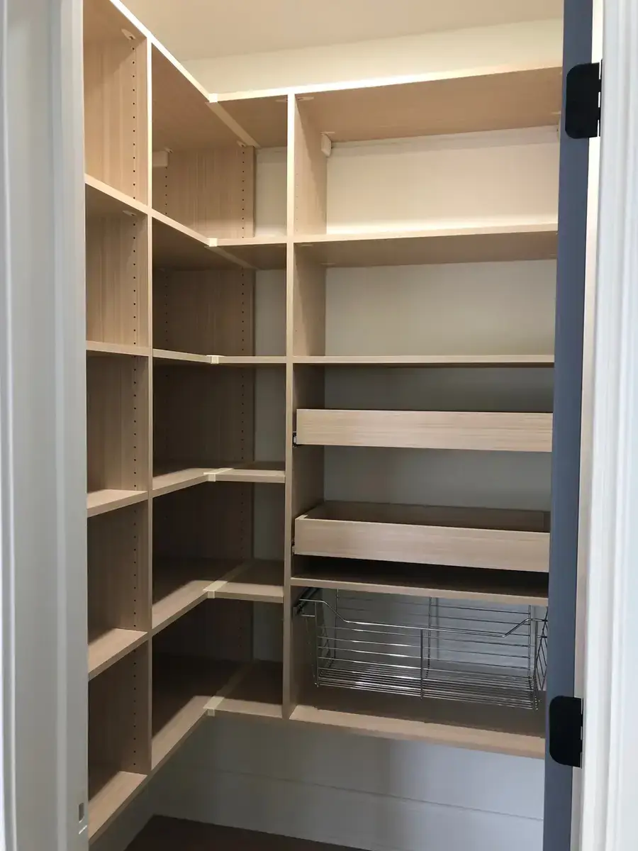 Custom pantry with organized shelving and pull-out baskets