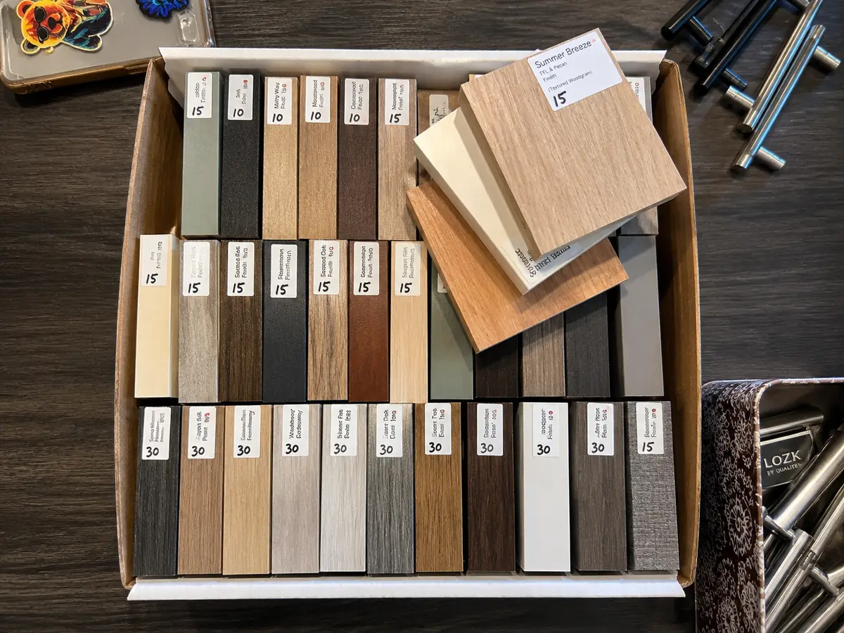 Dozens of custom finish samples available at Comfort Concepts QCA showroom — wood grains, dark tones, and neutral palettes