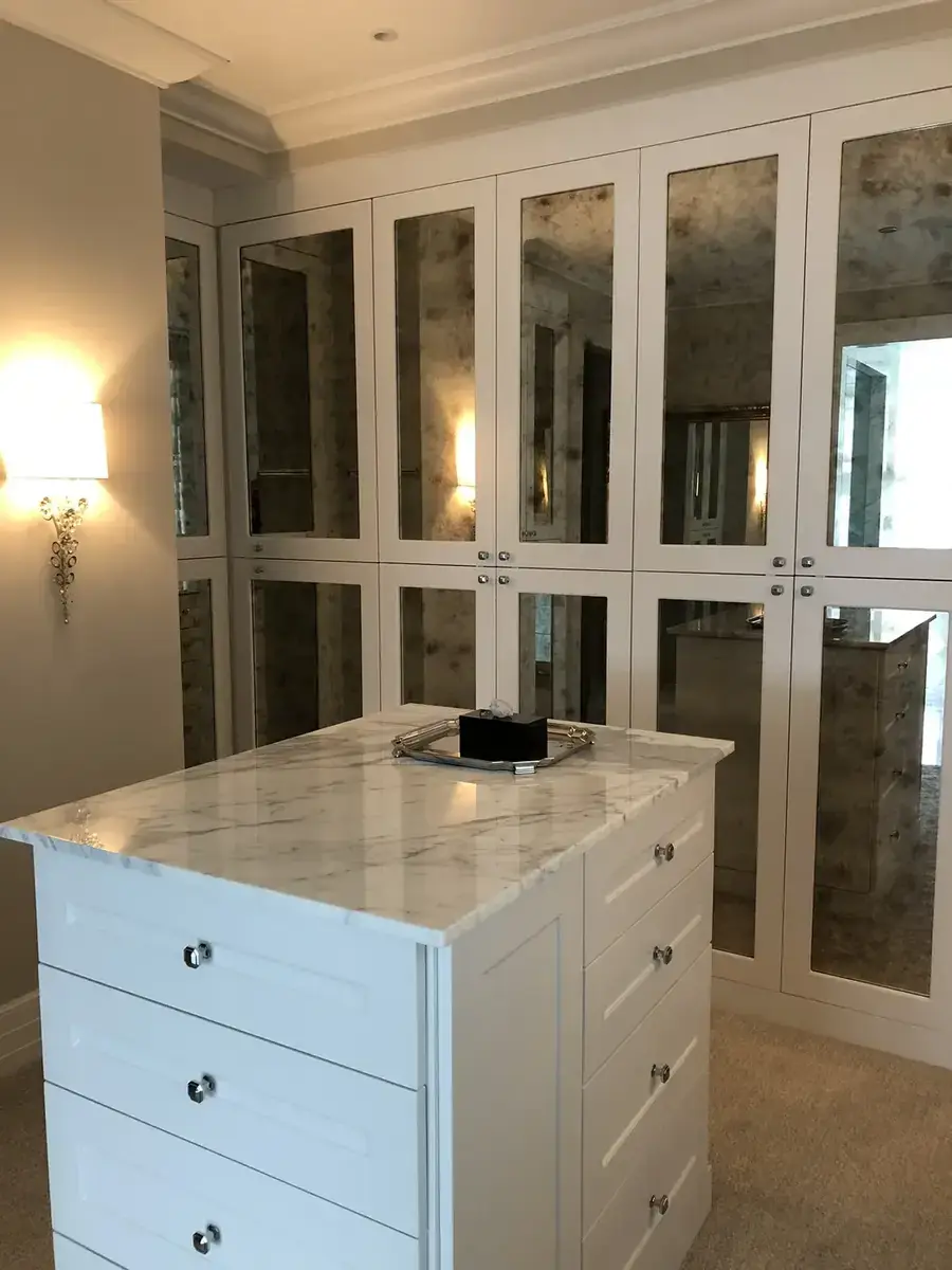 Walk-in closet with antique mirror island
