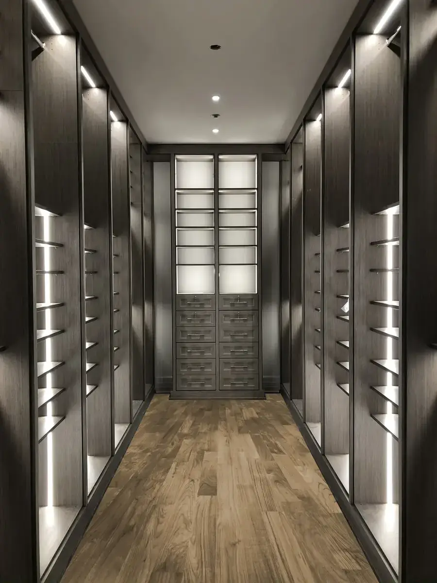Dark walk-in closet corridor with LED lighting